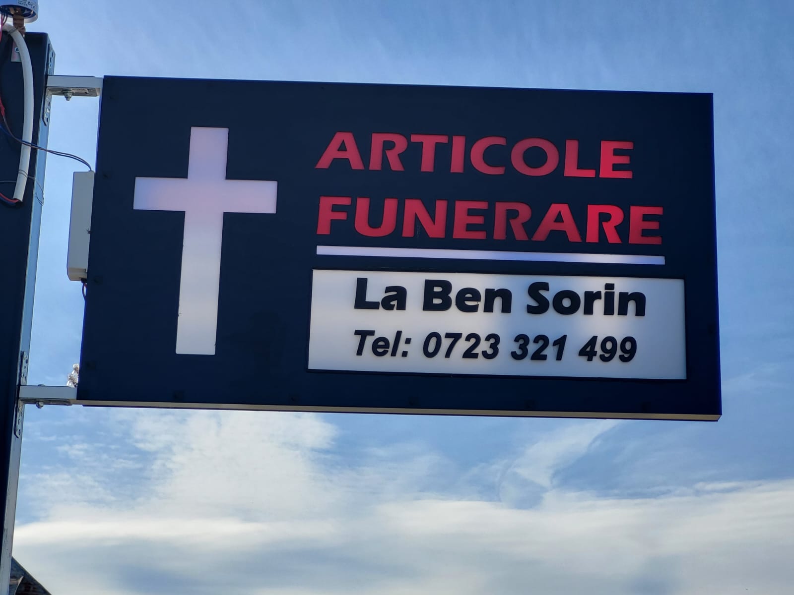 peaceful serene chapel interior with soft natural light, wooden pews, white flowers, calming atmosphere, professional photography